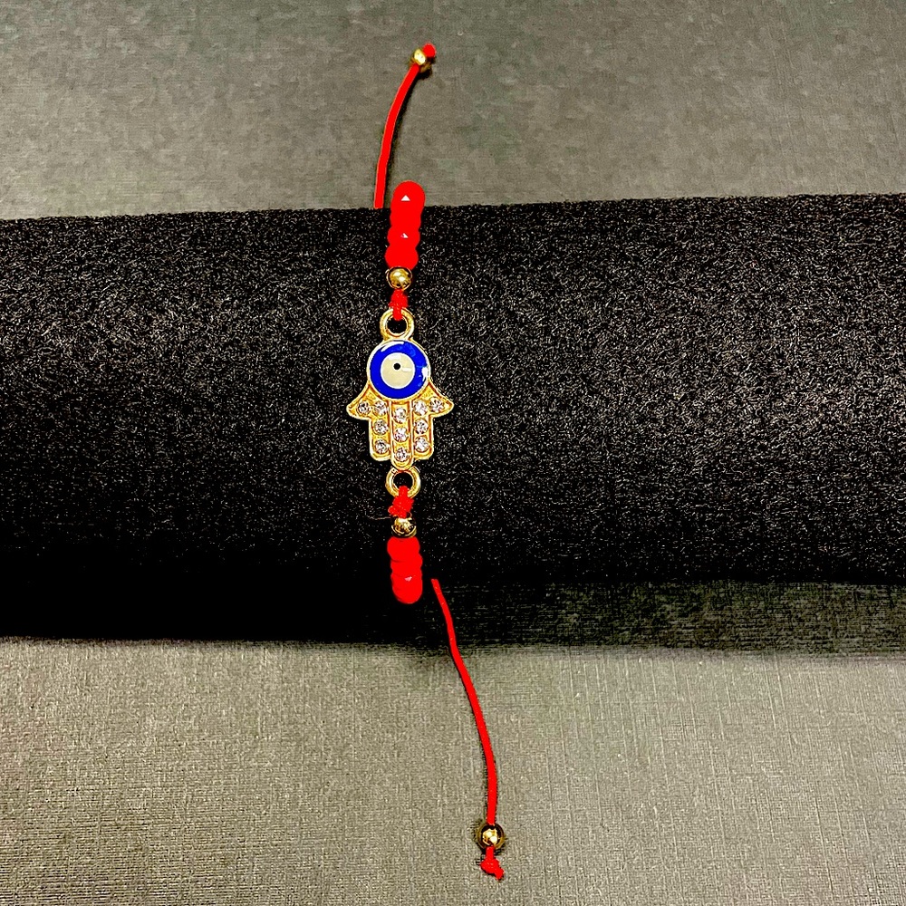 Hamsa Evil Eye charm- symbol of good luck
red stand with red and gold beads NEW